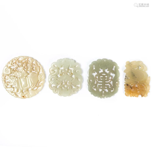 FOUR CHINESE CARVED HARDSTONE PENDANTS