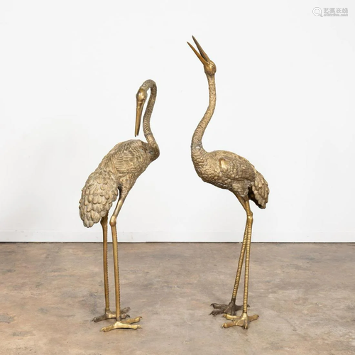 PAIR, MONUMENTAL STANDING BRASS CRANES