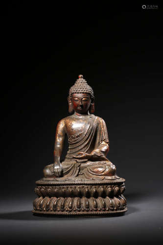 A GILT BRONZE STATUE OF SHAKYAMUNI