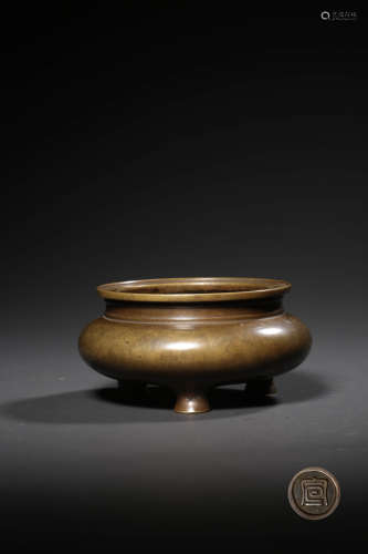 A BRONZE CONICAL TRIPOD INCENSE BURNER