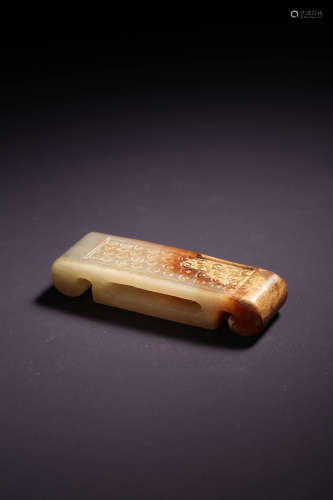 A WHITE AND RUSSET JADE SWORD FITTING