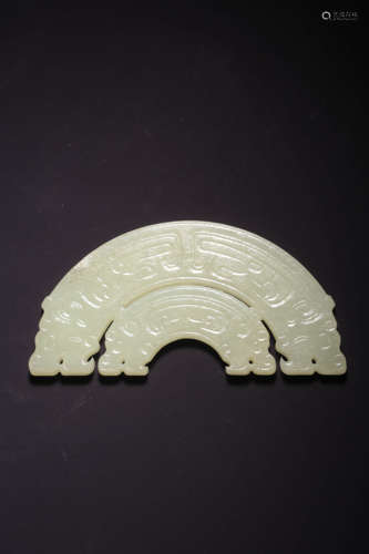 A CARVED WHITE JADE ARCHAIC TWIN-DRAGON ORNAMENT, BI