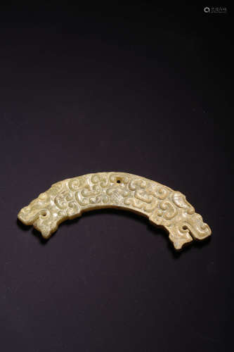A CARVED JADE TWIN-DRAGON ORNAMENT, HUANG