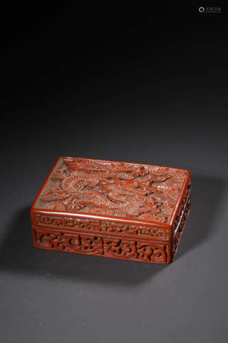 A CINNABAR LACQUER BOXIANG FLOWERS AND DRAGON RECTANGULAR BO...