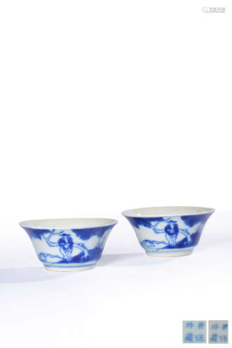 A PAIR OF BLUE AND WHITE FIGURE AND LANDSCAPE CUPS