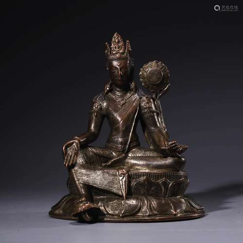 A Bronze Statue Of Green Tara