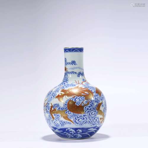 An Underglaze-Blue And Copper-Red Dragon And Wave Bottle Vas...