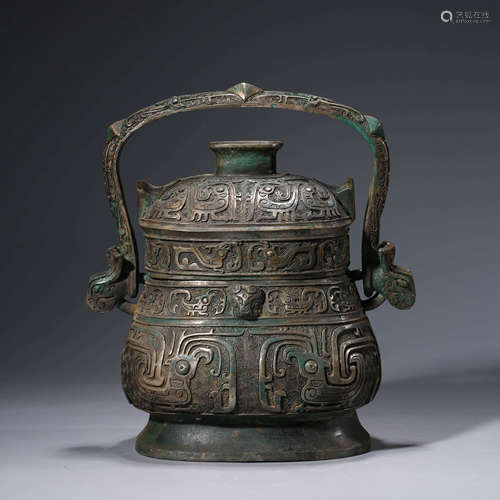 A Bronze Loop-Handle Vessel, You