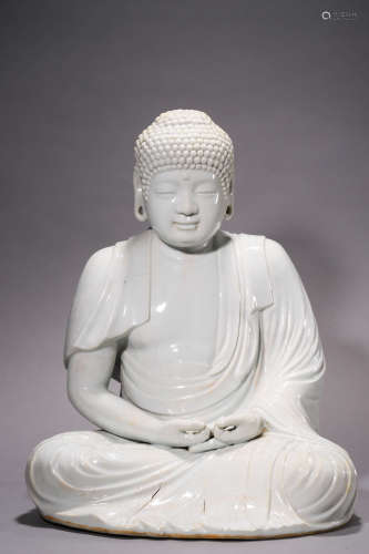 A White Glazed Porcelain Figure of Buddha, Qing Dynasty