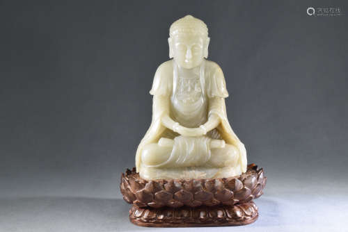 A Carved White Jade Figure of A Seated Buddha