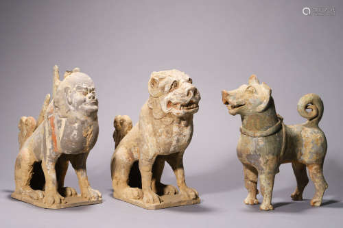A Group of Three Painted Gray Pottery Figures of Mythical Be...