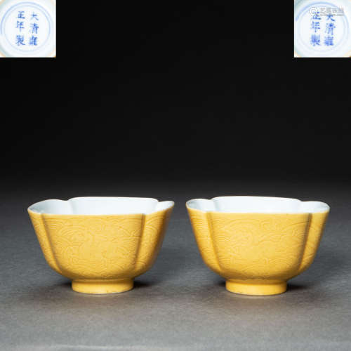 A PAIR OF CHINESE YELLOW-GLAZED PORCELAIN TEA CUPS, QING DYN...