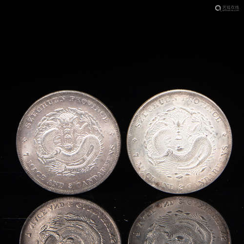 A PAIR OF CHINESE STERLING SILVER COINS, QING DYNASTY