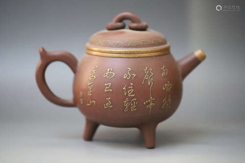 A Three Feet Purple Clay Teapot