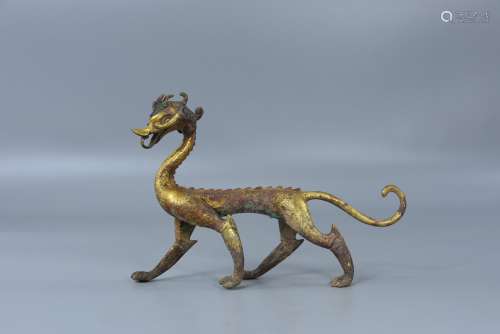 Walking dragon with bronze and gold plating in Han Dynasty