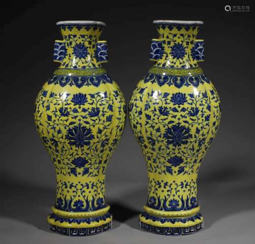 A PAIR OF QING DYNASTY YELLOW GROUND BLUE AND WHITE WALL VAS...