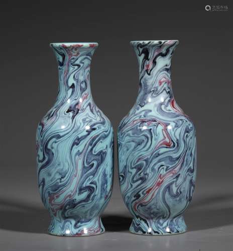 A PAIR OF QING DYNASTY TWISTED PLACENTA BOTTLES