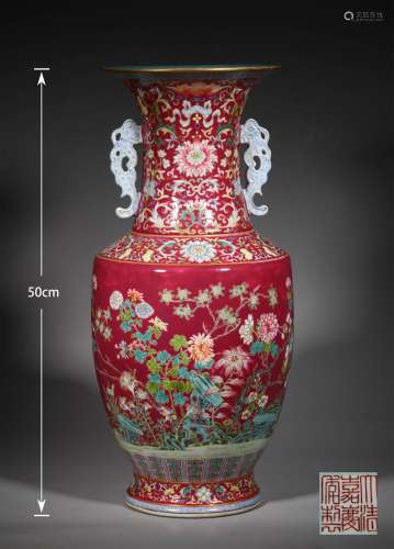 A QING DYNASTY RED GROUND FAMILLE ROSE FLOWER ORNAMENTAL BOT...