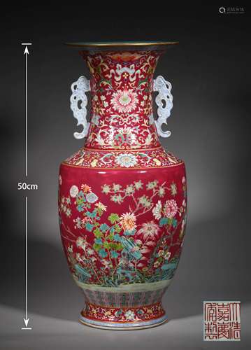 A QING DYNASTY RED GROUND FAMILLE ROSE FLOWER ORNAMENTAL BOT...