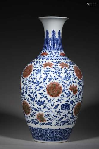 A QING DYNASTY BLUE AND WHITE UNDERGLAZE RED INTERLOCK BRANC...