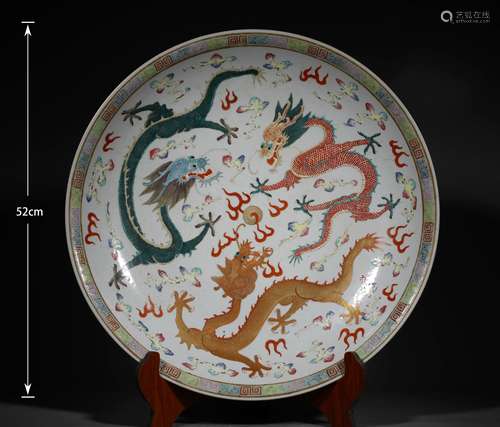 A QING DYNASTY FAMILLE ROSE DRAGON PLATE