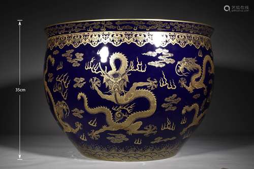 A QING DYNASTY JI BLUE GLAZE GOLD DRAWING DRAGON GRAIN PAINT...