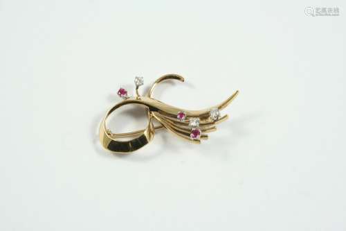 A GOLD, RUBY AND DIAMOND BROOCH the yellow gold scrolling mo...