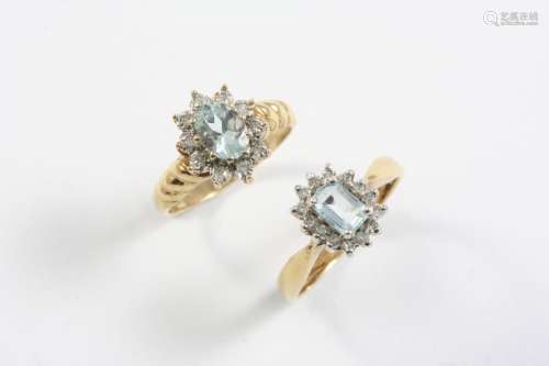 AN AQUAMARINE AND DIAMOND CLUSTER RING the oval-shaped aquam...
