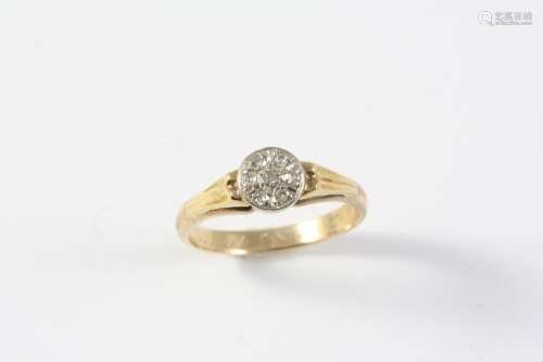 A DIAMOND CLUSTER RING mounted with single-cut diamonds in y...