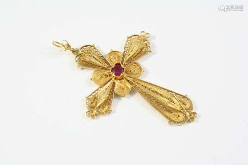 AN 18CT GOLD AND RUBY CRUCIFORM PENDANT the filigree openwor...