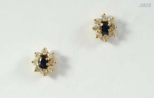 A PAIR OF SAPPHIRE AND DIAMOND CLUSTER STUD EARRINGS each ea...