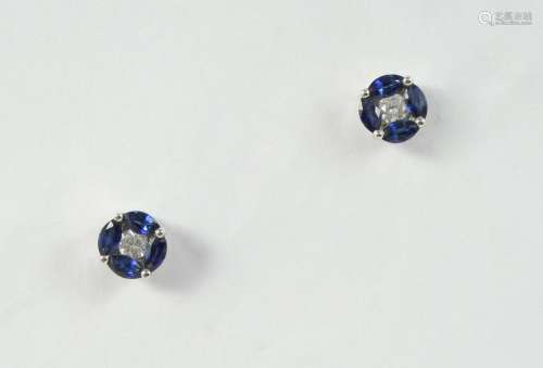 A PAIR OF SAPPHIRE AND DIAMOND STUD EARRINGS each set with a...