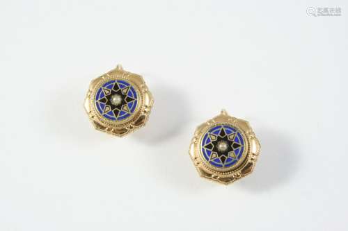 A PAIR OF ENAMEL AND GOLD EARRINGS each earring centred with...