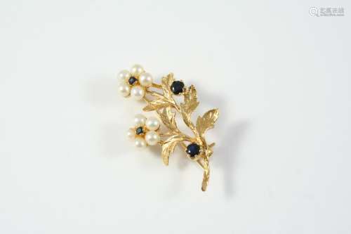 A SAPPHIRE AND CULTURED PEARL FOLIATE SPRAY BROOCH mounted w...