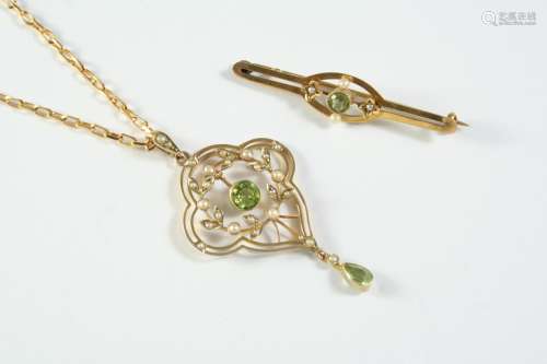 AN EDWARDIAN PERIDOT AND PEARL PENDANT the 9ct gold openwork...