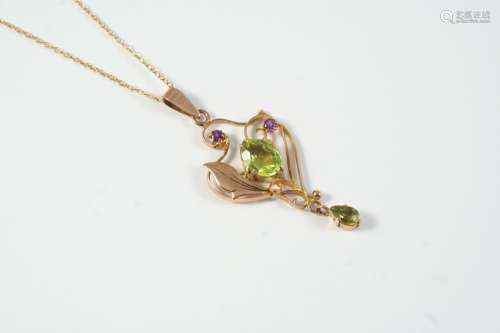 A PERIDOT AND AMETHYST PENDANT the 9ct gold openwork mount i...