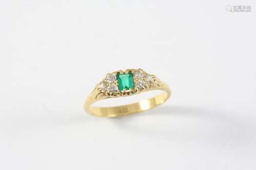 AN EMERALD AND DIAMOND RING the rectangular-shaped emerald i...