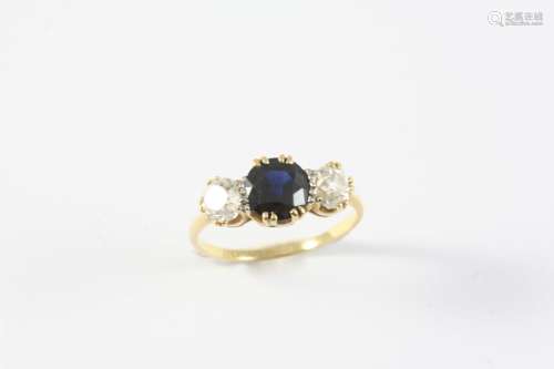 A SAPPHIRE AND DIAMOND THREE STONE RING the circular-cut dia...