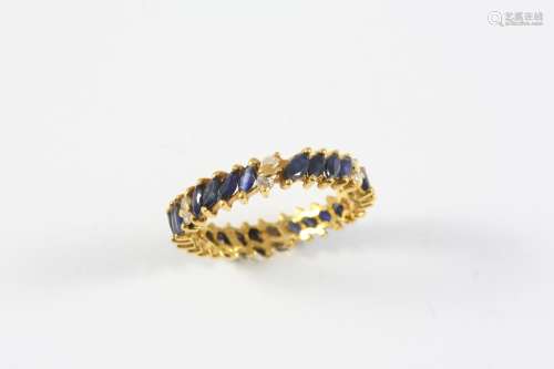 A SAPPHIRE AND DIAMOND FULL CIRCLE ETERNITY RING set with ma...