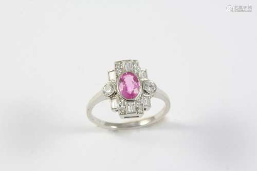 A PINK SAPPHIRE AND DIAMOND CLUSTER RING the oval-shaped pin...