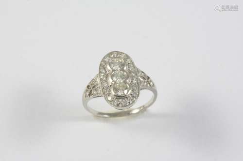 A DIAMOND CLUSTER RING the three central collet set circular...