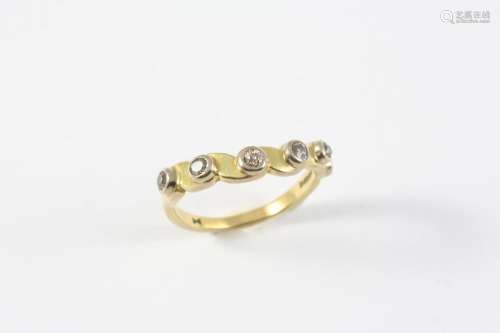 A GOLD AND DIAMOND HALF HOOP RING the 18ct gold band is moun...