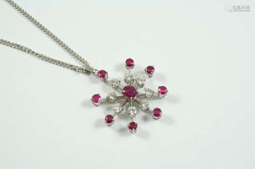 A RUBY AND DIAMOND STAR PENDANT set with circular-cut rubies...