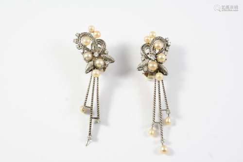 A PAIR OF DIAMOND AND CULTURED PEARL DROP EARRINGS of foliat...