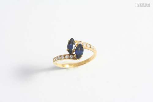 A SAPPHIRE AND DIAMOND RING BY CARTIER mounted with two marq...
