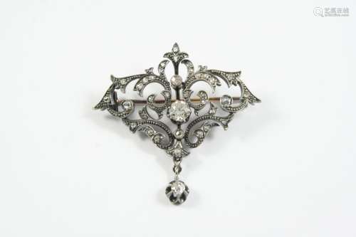 A VICTORIAN DIAMOND BROOCH the scrolling openwork mount is c...