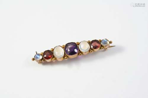 A MOONSTONE, AMETHYST AND GARNET BROOCH mounted with a cushi...