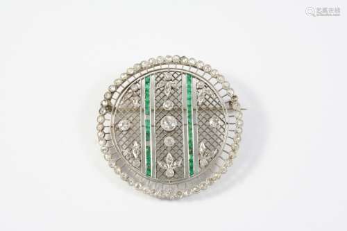 A BELLE EPOQUE EMERALD AND DIAMOND BROOCH the circular openw...