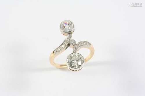 AN EARLY 20TH CENTURY DIAMOND RING mounted with two collet s...