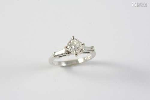A DIAMOND SOLITARIE RING the cushion-shaped diamond is set w...
